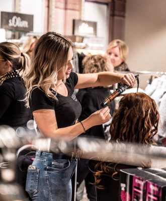 woman-styling-hair